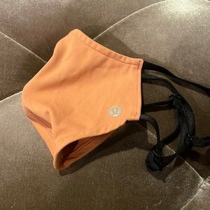 Never worn Lululemon double strap face mask